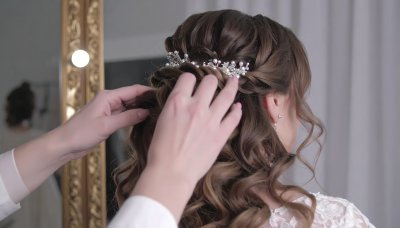 Bridal updo with pearl and crystal accessory, romantic beauty