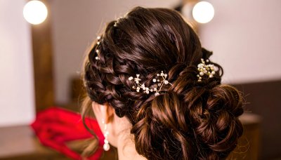 Elegant braided updo with pearls and crystals