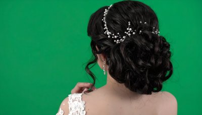 Bride with pearl hair accessory on green screen for visual effects