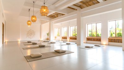 Serene yoga studio with natural light and woven lamps inspiring peace