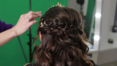 Braided hairstyle with gold on green screen for fantasy video