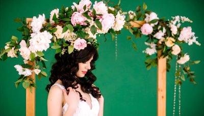 Woman with floral crown on green screen for compositing