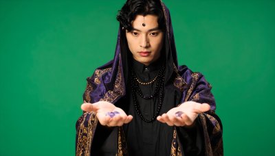 Wizard casting spells on green screen for video effects