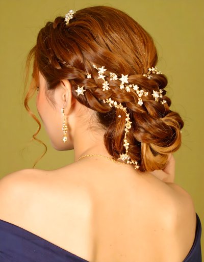 Elegant bride with braided updo and sparkling star hair accessories