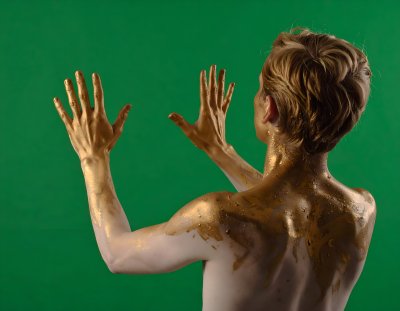 Captivating golden figure on green screen for artistic compositing