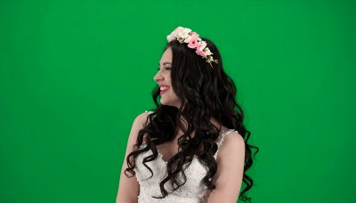 Bride with floral crown on green screen for fairytale scene