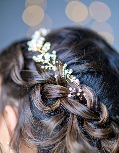 Elegant bridal braid with pearl and crystal hair accessories