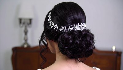 Elegant bride with intricate updo and crystal hairvine