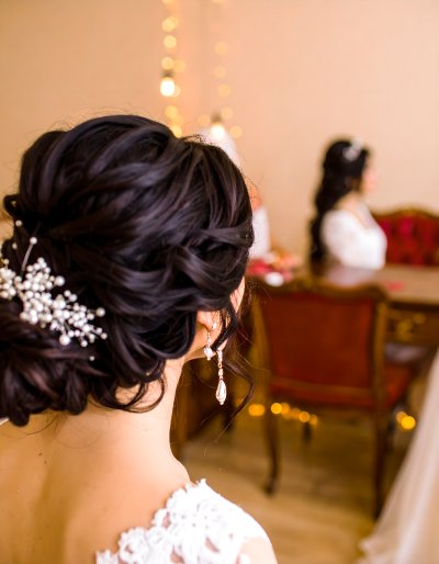 Bride with elegant updo and diamond earrings