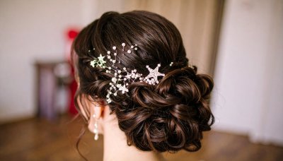 Elegant bridal updo with sparkling star accessory