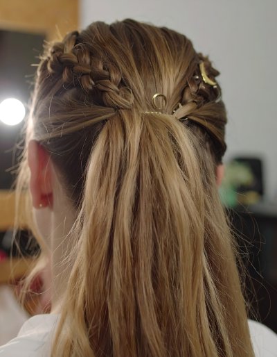 Elegant braided hairstyle with golden hair accessories