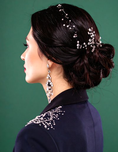 Elegant woman with sparkling jewelry on green screen for digital compo