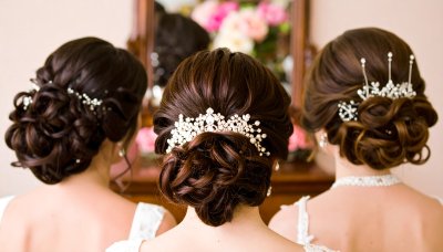 Bridesmaids with ornate hair accessories radiating elegance and joy