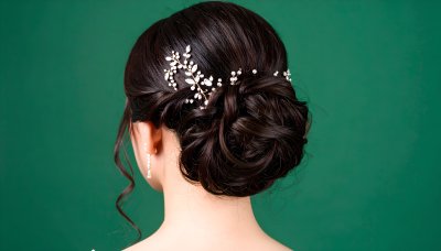 Elegant bridal hairstyle with crystal accessory on green screen