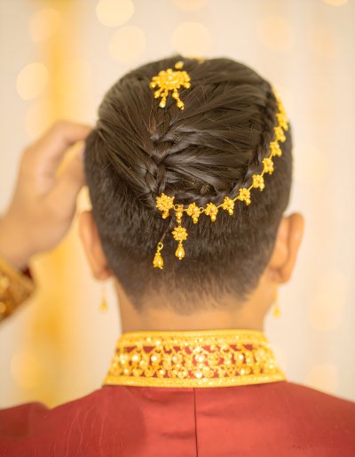 Braided Hair with Golden Jewelry, Inspiring Regal Elegance