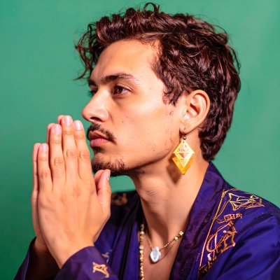 Man praying on green screen for creative compositing