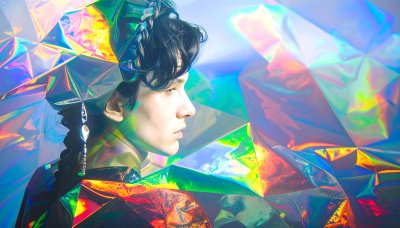 Person in iridescent light, embodying wonder & futurism.