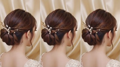Bride's elegant updo with sparkling crystal hair accessory