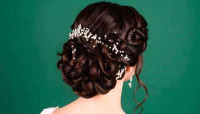 Bride's dark hair updo, crystal & pearl pins.