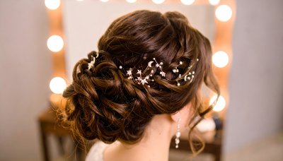 Bridal updo with star and moon hair accessories