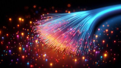 Glowing fiber optic strands transmitting vibrant light against dark ba