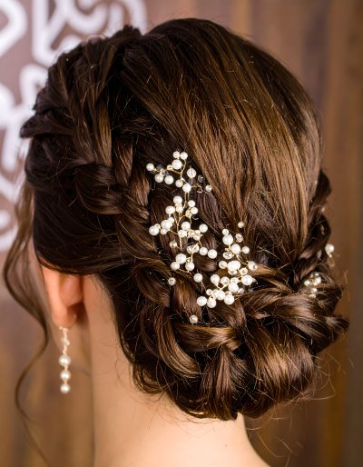 Elegant braided updo with pearl and crystal hairpins