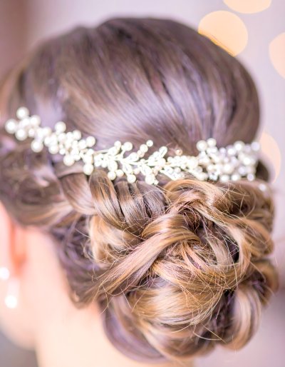 Elegant bridal hairstyle with pearl and crystal hairpiece