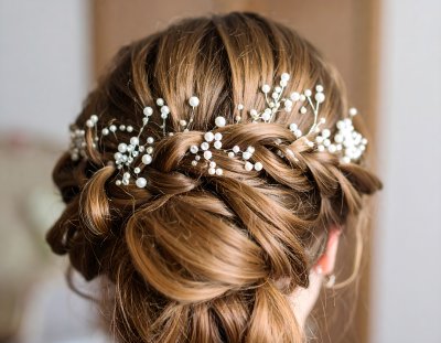 Romantic braided hairstyle adorned with delicate pearls and crystals