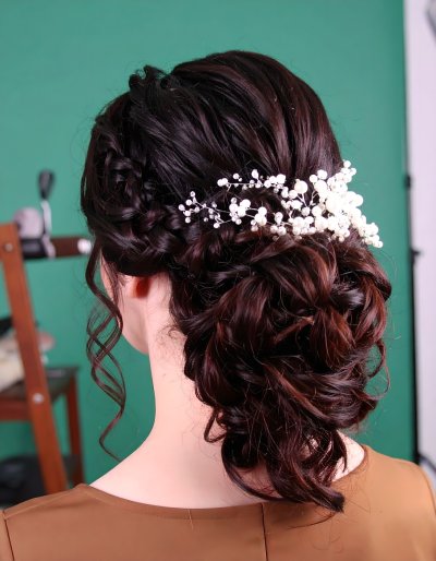 Elegant updo with pearl accessory on green screen for beauty projects
